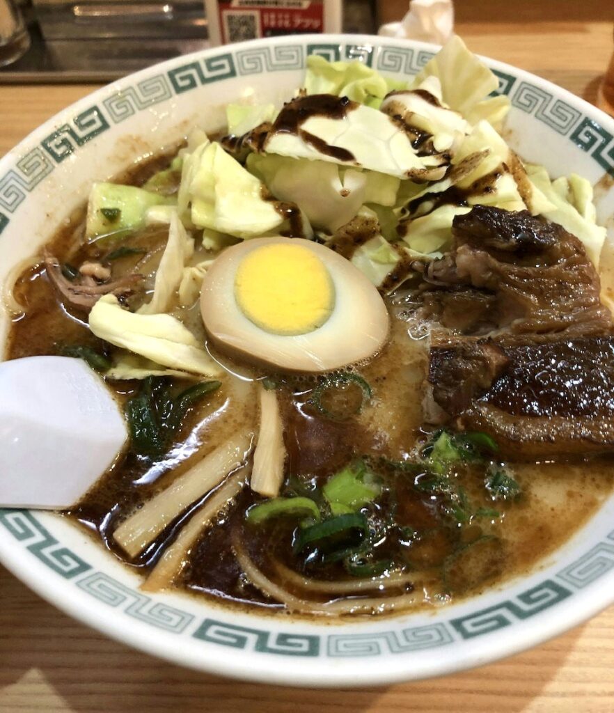 Keika's signature dish, "Taromen," is a rich pork bone ramen topped with tenderly stewed pork belly and cabbage. It is always the most popular menu item at Keika Ramen.