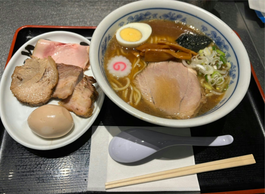 Chuka soba ramen with all toppings: assorted char siu, egg, menma, seaweed, and green onions