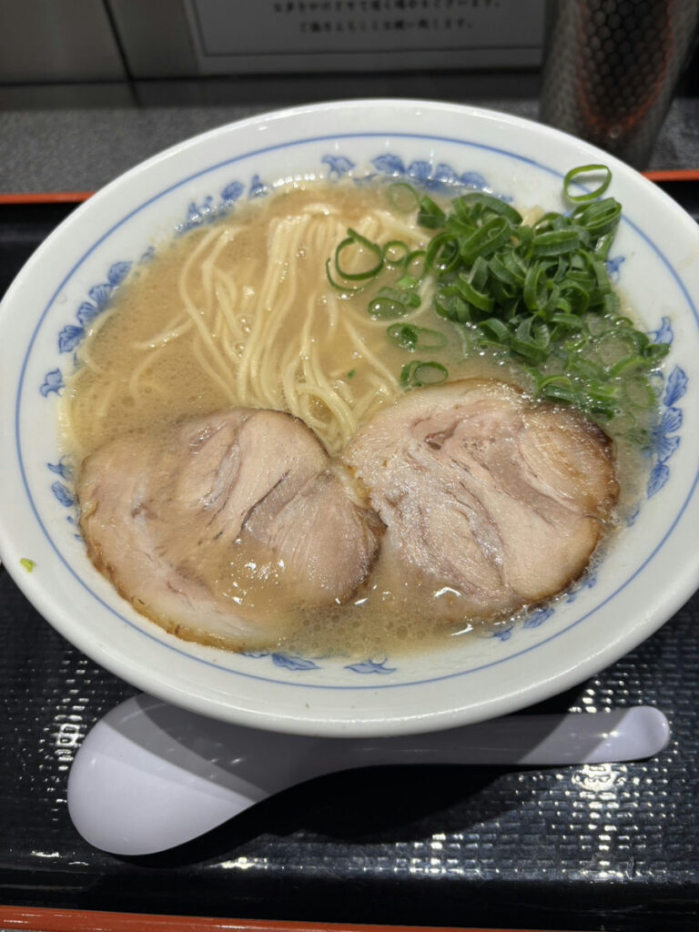 Limited tonkotsu ramen from Tomita, featuring rich pork bone broth, thin noodles, and tender chashu pork, served in Japan