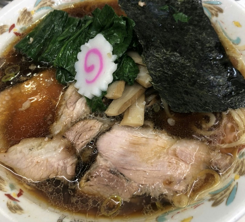 A bowl of Nagaoka-style ginger shoyu ramen served at Aoshima Shokudo Akihabara in Tokyo.