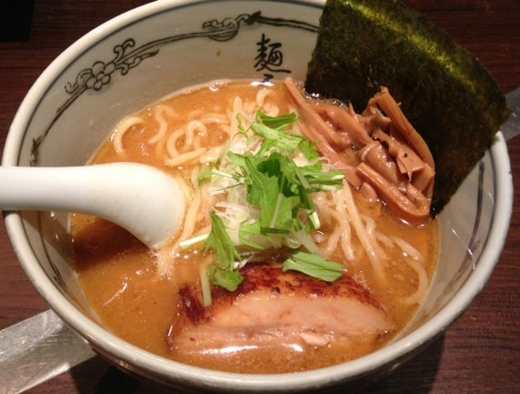 A bowl of shoyu ramen served at Menya Musashi Kanzan in Kanda, Tokyo, featuring a rich double broth of animal and seafood flavors.
