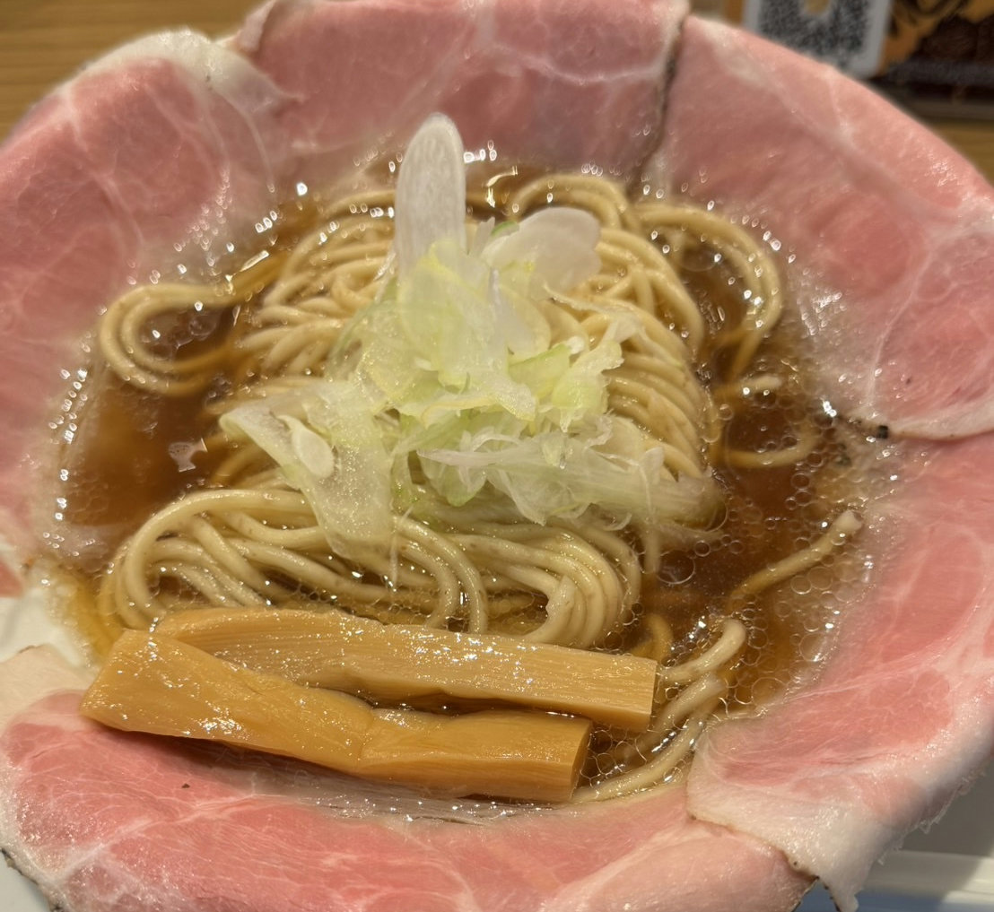 A bowl of shoyu ramen served at Ramen Daisenso in Kanda, Tokyo, featuring a savory Japanese-style broth with chicken and bonito flavors.