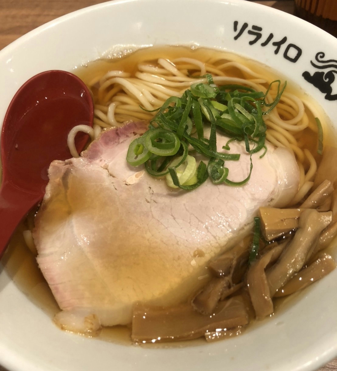 A bowl of light shoyu ramen with chicken and seafood broth served at Soranoiro NIPPON in Tokyo Station Ramen Street.